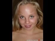 Sharka blue is sited on a sofa, legs appart and looking at you