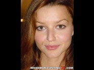 Talina is sited on a sofa, legs appart and looking at you