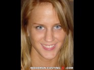 Cynthia paul is sited on a sofa, legs appart and looking at you