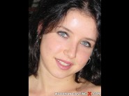 Tiffany hopkins is sited on a sofa, legs appart and looking at you