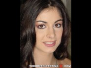 Lucy lee is sited on a sofa, legs appart and looking at you