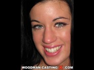 April blue is sited on a sofa, legs appart and looking at you