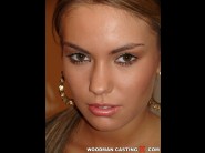 Veronika fasterova is sited on a sofa, legs appart and looking at you