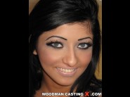 Clarissa is sited on a sofa, legs appart and looking at you