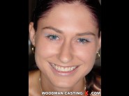 Anita is sited on a sofa, legs appart and looking at you