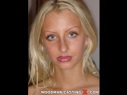 Suzie is sited on a sofa, legs appart and looking at you