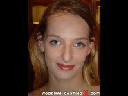 Lucia is sited on a sofa, legs appart and looking at you