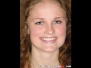 Marlen otha is sited on a sofa, legs appart and looking at you