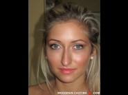 Karina shay is sited on a sofa, legs appart and looking at you