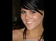 Madison parker is sited on a sofa, legs appart and looking at you