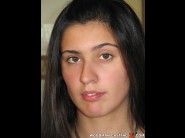 Diana stewart is sited on a sofa, legs appart and looking at you