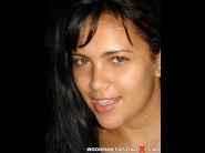 Babaloun is sited on a sofa, legs appart and looking at you