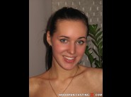 Wendy muller is sited on a sofa, legs appart and looking at you