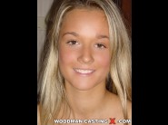 Carmen cocks is sited on a sofa, legs appart and looking at you