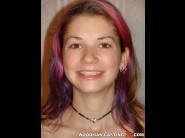 Anna is sited on a sofa, legs appart and looking at you