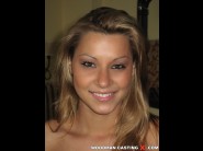 Cindy hope is sited on a sofa, legs appart and looking at you