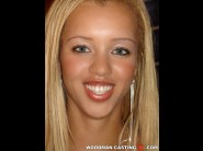 Barbie bank is sited on a sofa, legs appart and looking at you