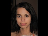 Ferrera gomez is sited on a sofa, legs appart and looking at you