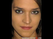 Silvie de lux is sited on a sofa, legs appart and looking at you