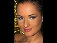 Luisa de marco is sited on a sofa, legs appart and looking at you