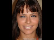 Simony diamond is sited on a sofa, legs appart and looking at you