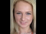 Ivana sugar is sited on a sofa, legs appart and looking at you