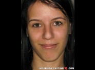 Adry - n is sited on a sofa, legs appart and looking at you