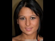 Alison star is sited on a sofa, legs appart and looking at you