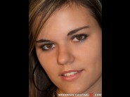 Rosee is sited on a sofa, legs appart and looking at you