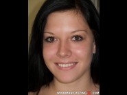 Vivienne is sited on a sofa, legs appart and looking at you