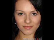 Katty n is sited on a sofa, legs appart and looking at you