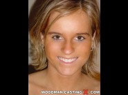 Kirsty is sited on a sofa, legs appart and looking at you