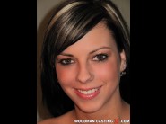 Mellie swan is sited on a sofa, legs appart and looking at you