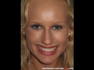 Angel wicky is sited on a sofa, legs appart and looking at you