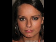 Kari milla is sited on a sofa, legs appart and looking at you