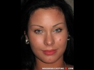 Alyssia is sited on a sofa, legs appart and looking at you