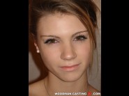 Ally is sited on a sofa, legs appart and looking at you