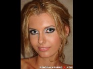 Aniko is sited on a sofa, legs appart and looking at you