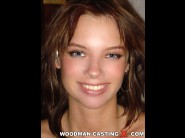 Monica is sited on a sofa, legs appart and looking at you