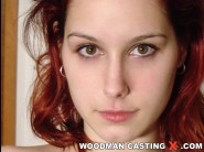 Jolly is sited on a sofa, legs appart and looking at you