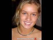 Sarah blue is sited on a sofa, legs appart and looking at you