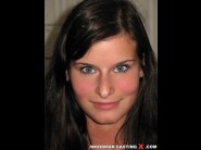 Megan  b is sited on a sofa, legs appart and looking at you