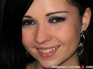 Angell summers is sited on a sofa, legs appart and looking at you