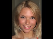 Summer breeze is sited on a sofa, legs appart and looking at you