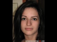 Ann-marie la sante is sited on a sofa, legs appart and looking at you