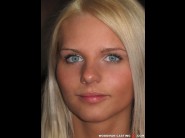 Katkam is sited on a sofa, legs appart and looking at you