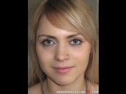 Virginee is sited on a sofa, legs appart and looking at you