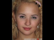 Lolly moon is sited on a sofa, legs appart and looking at you