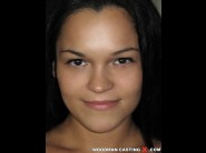 Sandra rodriguez is sited on a sofa, legs appart and looking at you