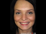 Anabell is sited on a sofa, legs appart and looking at you